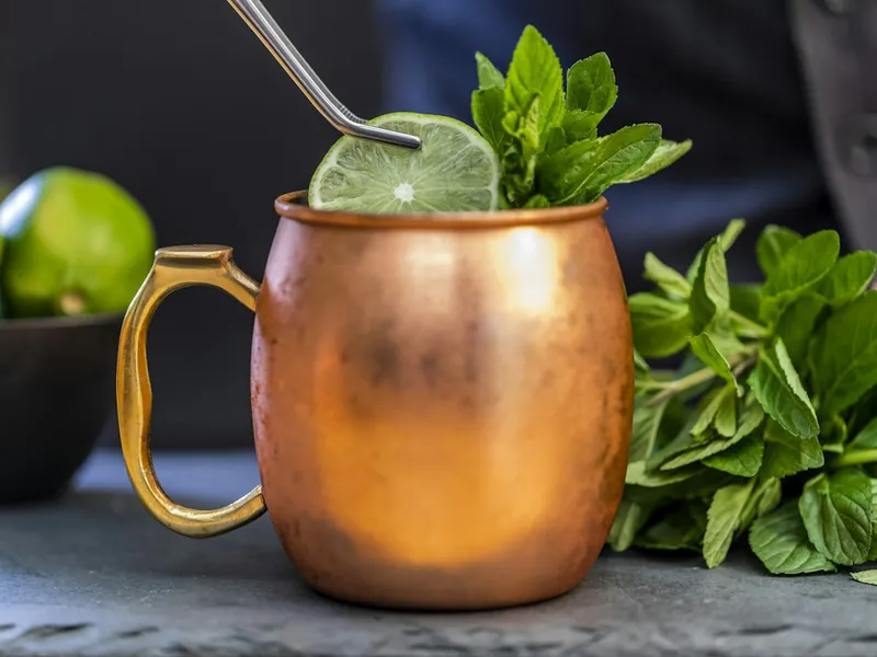 Moscow mule in a copper mug with lime and fresh mint